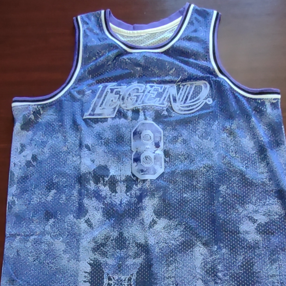 Purple Legend 8/24 basketball jersey.
